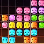 カラフルで顔の表情をしたブロックが整然と並んでいるグリッド。