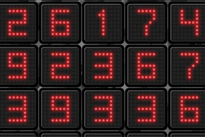 赤いドットで構成された数字が配置された黒い背景の四角いパネルの画像。