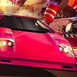ピンク色のスポーツカーが街中を高速で走っている様子。