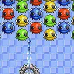 青色の背景に、赤、青、緑、黄色のパズルピースが並び、下部にギアと矢印がある。
