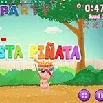 カラフルな「FIESTA PIÑATA」の文字と木の下でパーティーの飾りがある風景。