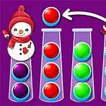 紫色の背景に、サンタクロースと雪だるまが描かれた画面、カラフルなボールが試験管に並んでいる。