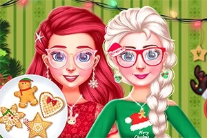 クリスマスの装飾がされた背景の前に、赤い髪と白い髪の女性がクリスマス柄の服を着ている。