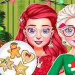 クリスマスの装飾がされた背景の前に、赤い髪と白い髪の女性がクリスマス柄の服を着ている。