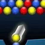 色とりどりの玉が並び、中央に発射装置がある様子。