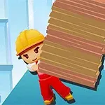 建設作業員が赤い作業服を着て、木材を運んでいる。