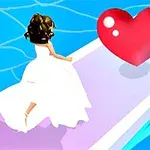ウェディングドレスを着た女性が、ピンクのハートに向かって歩道を歩いている。