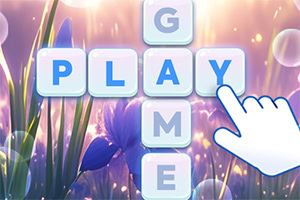 花と光の背景に、ブロックの文字「PLAY」と「GAME」がクロスして配置され、指が「Y」を指している画像。