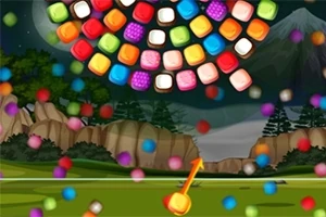 カラフルなブロックが夜の山と森を背景に散らばっている画像。