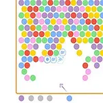 色とりどりの円が画面上部に並び、下部中央から矢印で示された色付きの円が発射されるパズルゲームの画面。