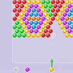カラフルな玉が整然と並び、下部中央に矢印が方向を示している画面。