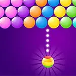 紫色の背景にカラフルなボールが並び、下に虹色のボールが矢印でターゲットを示している。