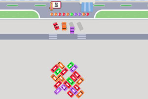 道路に複数の色とりどりの車が並び、交差点に向かって進んでいる様子。