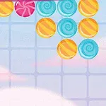 カラフルなキャンディが空に浮かんでいるイラスト。