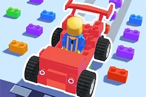 赤いブロックで作られた車に乗る黄色いキャラクターと周囲に散らばる色とりどりのブロック。