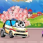 桜の木の前で大きな目がついたパトカーと紫色の車が並んでいる風景。