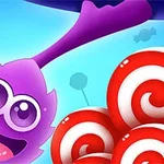 紫色のキャラクターが笑顔で現れ、背景には青い空と赤白の渦巻きキャンディが見えるイラスト。