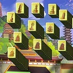 重ねられた塔の絵が描かれたタイルと背景に日本風の寺院が描かれているイラスト。