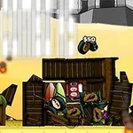 砂漠の背景に木の小屋が崩れており、帽子をかぶったキャラクターが地面にいる様子。