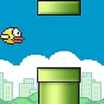 青空の下、黄色い鳥が緑のパイプの間を飛ぶドット絵のシーン。