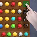 色とりどりのボールが並ぶ木製ボードと、チェックマークを指さす手。