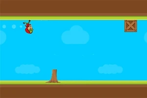 青空の背景に木の切り株と木箱があるシンプルな2Dゲームの画面。