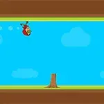 青空の背景に木の切り株と木箱があるシンプルな2Dゲームの画面。
