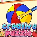 ノートに描かれたカラフルなボールを絵筆で塗っているイラストと「creative puzzle」の文字。