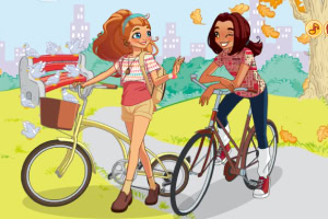 自転車に乗った二人の女の子が公園で楽しげな様子で会話している。