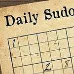 古風な紙に印刷された数独パズルの一部と羽根ペン。