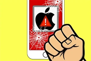 黄色の背景に、画面が割れたスマートフォンとアップルの警告アイコン、握り拳。