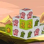 積み重ねられたブロックに豚やワニの絵が描かれており、背景に山と湖がある風景。