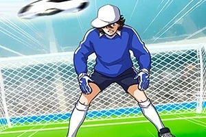 サッカーゴールの前でキャップを被ったゴールキーパーがボールを止めようとしている。