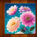 カラフルなピンクとオレンジの花が描かれた、部分的に完成されたパズル。