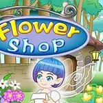 青い髪の妖精と色とりどりの花が飾られた「Flower Shop」の看板。