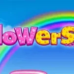 カラフルな虹と「flowers」の文字が青空に浮かんでいる画像。