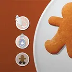 茶色と白の背景にジンジャーブレッドマンの形をしたクッキーとデコレーション用のアイテムが描かれているイラスト。