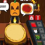 かぼちゃの仮装をしたキャラクターが、ピザ生地とトッピング材料が並んだカウンターの前に立っている。