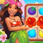 ハワイアン衣装の女性が、花や果物の絵が描かれたパズルボードを指差している。