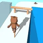 茶色のクマのキャラクターが高所の白い道を一輪車で進んでいる。