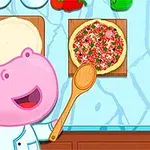 ピンクのカバのシェフがスプーンを持ちながら、テーブルに置かれたピザを見ている。