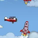 赤い飛行機とロケットが青空を飛んでいる。