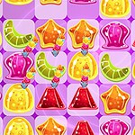 カラフルなゼリーやグミが格子状に並んでいる紫色の背景の画像。