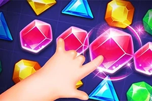 色とりどりの宝石に触れようとする手。