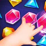 色とりどりの宝石に触れようとする手。