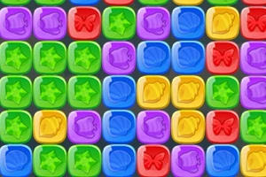 カラフルな正方形のブロックに星、貝殻、ベル、蝶の模様が描かれているパズルのイメージ。