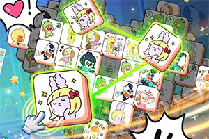 カラフルなキャラクターのイラストが描かれた立方体が積み重なり、手がそのうちの1つに触れている様子。