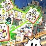 カラフルなキャラクターのイラストが描かれた立方体が積み重なり、手がそのうちの1つに触れている様子。