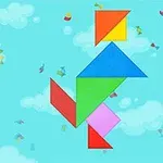 青空にカラフルな図形が組み合わさったパズルのシルエットが浮かんでいる。