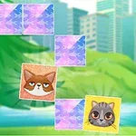 公園の背景に猫の表情が描かれたカードが配置された場面。